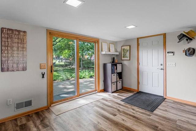 9009 44th Cir N, New Hope, MN 55428 - doorway featuring wood finished floors and baseboards
