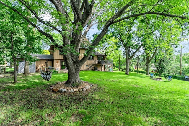 9009 44th Cir N, New Hope, MN 55428 - view of green lawn with a wooden deck