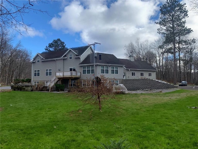 5393 Bachelor Rd NW, Hackensack, MN 56452 - rear view of property with stairs, a deck, and a lawn