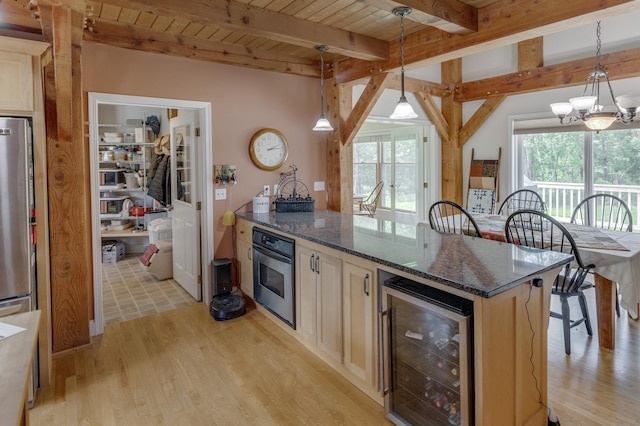 5393 Bachelor Rd NW, Hackensack, MN 56452 - kitchen with beverage cooler, stainless steel appliances, healthy amount of natural light, light wood finished floors, and a wooden ceiling with exposed beams