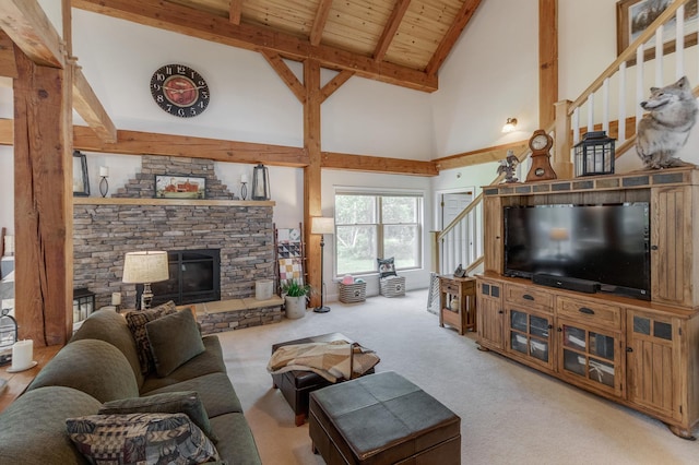 5393 Bachelor Rd NW, Hackensack, MN 56452 - carpeted living room with high vaulted ceiling, a fireplace, and a wooden ceiling with exposed beams