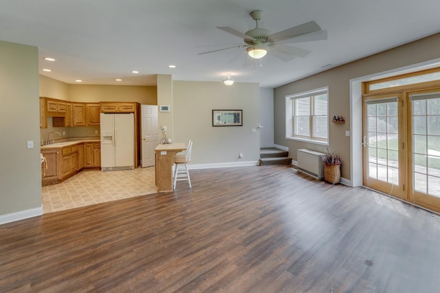 5393 Bachelor Rd NW, Hackensack, MN 56452 - living room featuring light wood-style flooring, ceiling fan, recessed lighting, and stairway