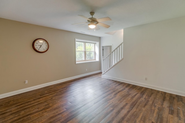5393 Bachelor Rd NW, Hackensack, MN 56452 - empty room with ceiling fan, dark wood finished floors, and stairs