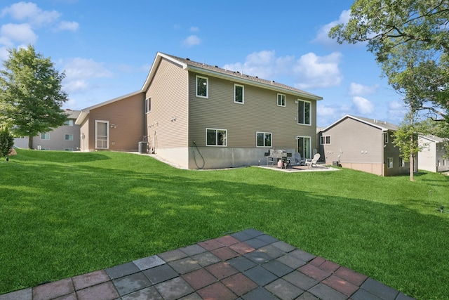 1465 19th St SE, Saint Cloud, MN 56304 - back of house with a patio and a yard
