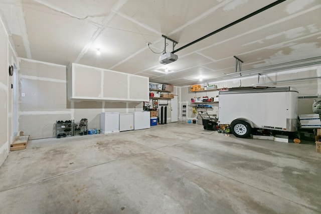 1465 19th St SE, Saint Cloud, MN 56304 - garage featuring a garage door opener
