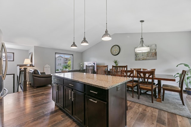 1465 19th St SE, Saint Cloud, MN 56304 - kitchen featuring lofted ceiling, dark wood-style flooring, decorative light fixtures, and a center island