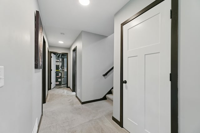 1465 19th St SE, Saint Cloud, MN 56304 - hall with light colored carpet, recessed lighting, and stairway