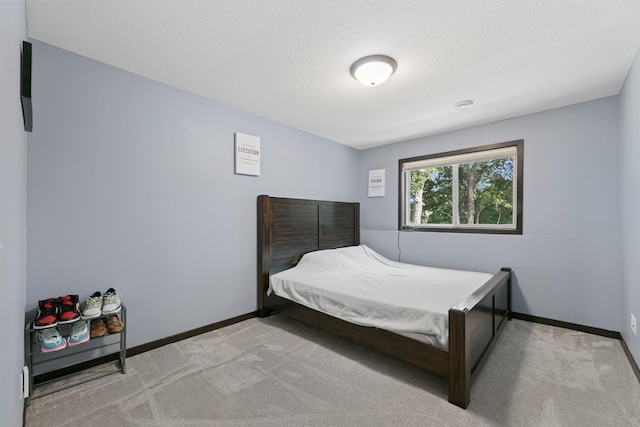 1465 19th St SE, Saint Cloud, MN 56304 - carpeted bedroom with baseboards and a textured ceiling