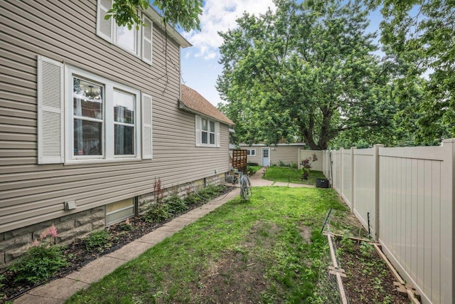 402 Clifton St, Saint Paul, MN 55102 - fenced backyard featuring an outbuilding