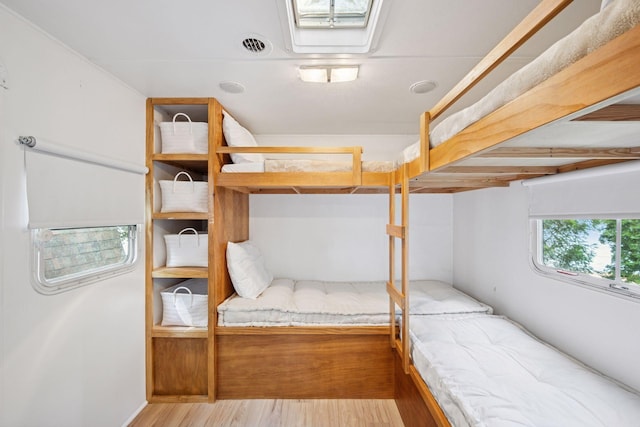 22281 670th Ave, Darwin Twp, MN 55324 - unfurnished bedroom featuring wood finished floors
