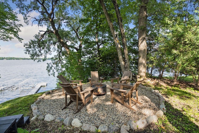 22281 670th Ave, Darwin Twp, MN 55324 - view of patio / terrace with a fire pit and a water view