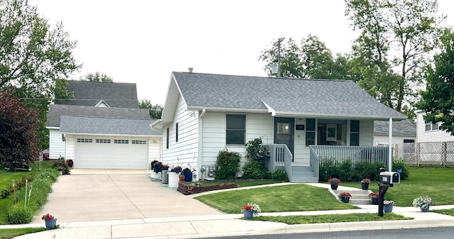 607 Washington Ave, Spring Valley, MN 55975 - view of front of property featuring a porch, concrete driveway, an attached garage, and a shingled roof