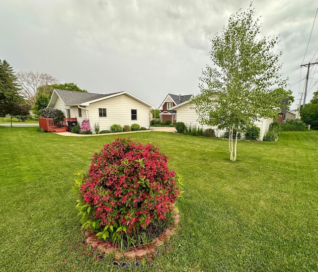 607 Washington Ave, Spring Valley, MN 55975 - view of front of property featuring a front yard and a deck