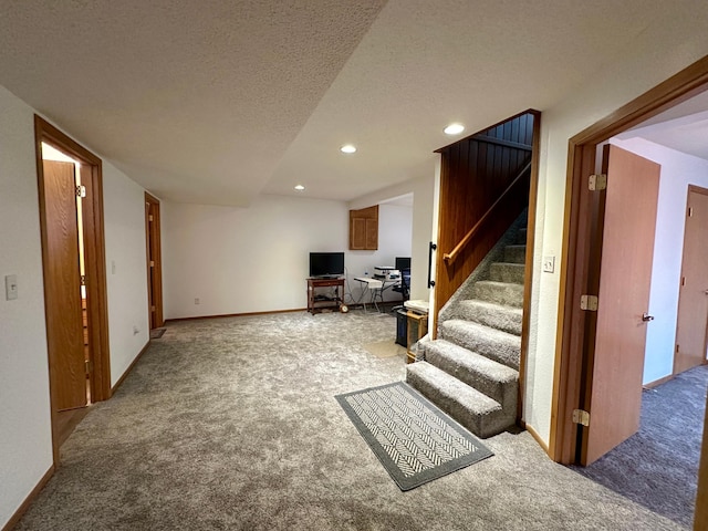 607 Washington Ave, Spring Valley, MN 55975 - finished below grade area with carpet, stairway, recessed lighting, and a textured ceiling