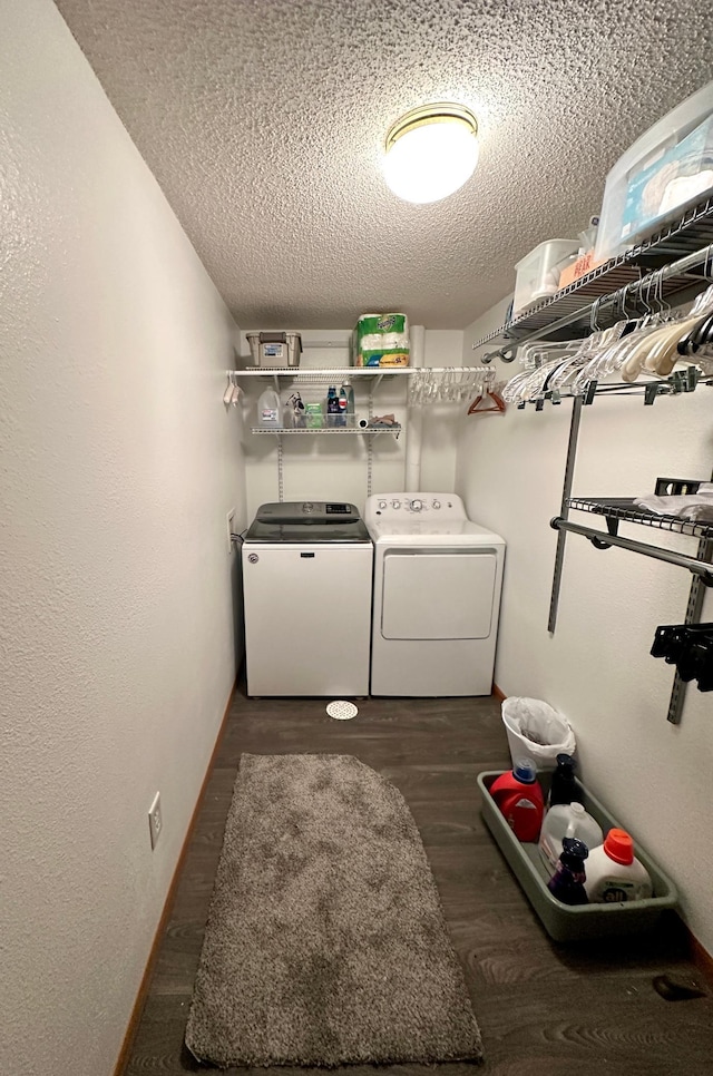 607 Washington Ave, Spring Valley, MN 55975 - laundry area featuring washing machine and dryer, a textured ceiling, and dark wood-style flooring