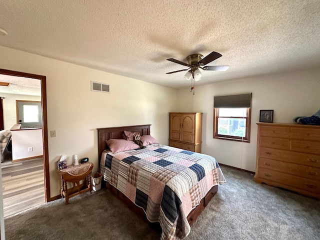 607 Washington Ave, Spring Valley, MN 55975 - bedroom featuring carpet flooring, ceiling fan, and a textured ceiling
