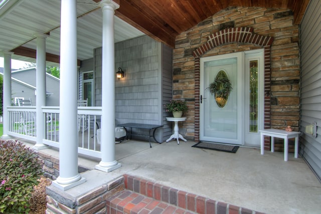 1403 Elm Ave W, Menomonie, WI 54751 - doorway to property featuring a porch and stone siding