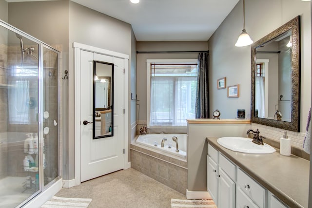1403 Elm Ave W, Menomonie, WI 54751 - bathroom with vanity, a shower stall, and a garden tub
