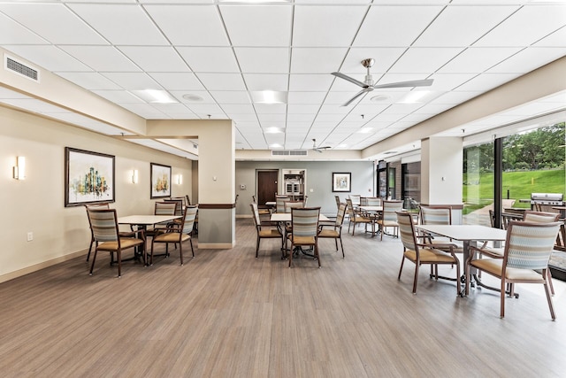 6615 Lake Shore Dr S Unit 900, Richfield, MN 55423 - dining room with light wood-style floors, a drop ceiling, and ceiling fan
