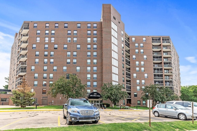 6615 Lake Shore Dr S Unit 900, Richfield, MN 55423 - view of apartment building / complex featuring uncovered parking