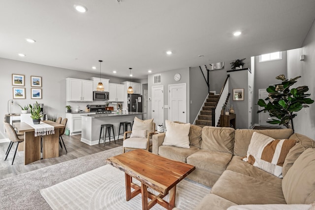 1771 Emerson Ct, Chaska, MN 55318 - living room with light wood-type flooring, recessed lighting, and stairway
