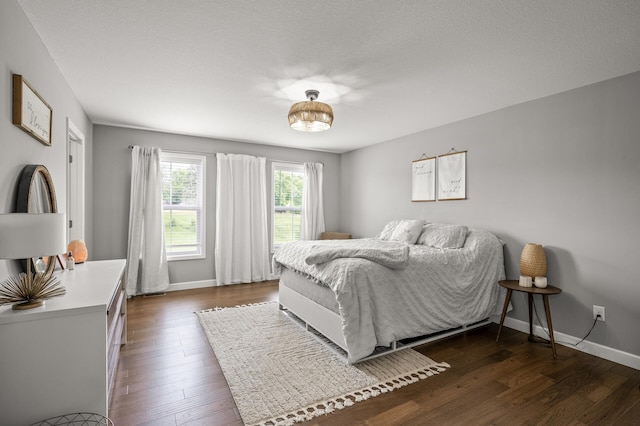 1771 Emerson Ct, Chaska, MN 55318 - bedroom featuring dark wood finished floors and baseboards