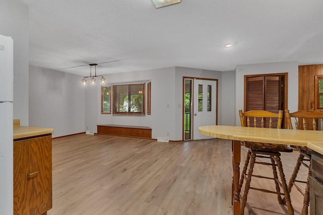 920 2nd Ave S, Sauk Rapids, MN 56379 - dining area featuring light wood-style floors, plenty of natural light, a chandelier, and recessed lighting