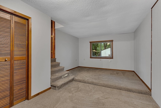 920 2nd Ave S, Sauk Rapids, MN 56379 - unfurnished living room with carpet, a textured ceiling, and stairs