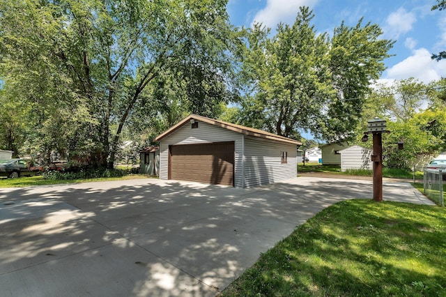 920 2nd Ave S, Sauk Rapids, MN 56379 - view of property exterior with a garage and an outbuilding