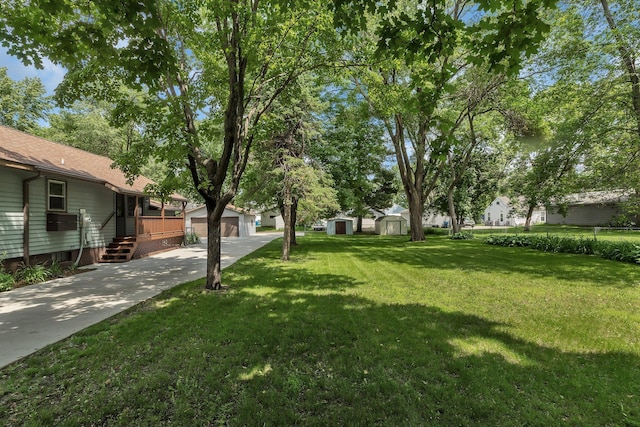 920 2nd Ave S, Sauk Rapids, MN 56379 - view of grassy yard with a storage shed