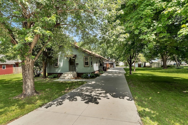 920 2nd Ave S, Sauk Rapids, MN 56379 - view of front of home with an outbuilding and a front yard