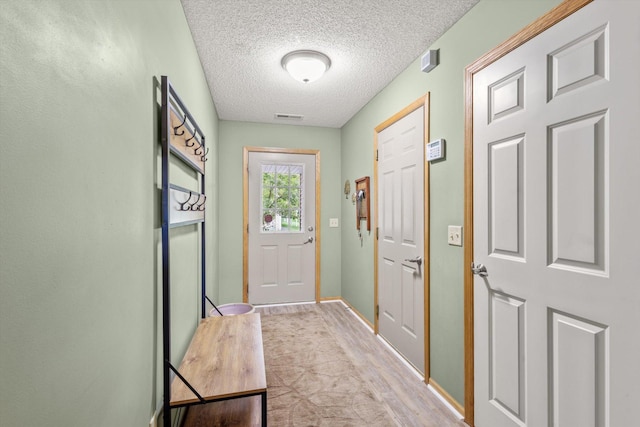 3123 Legacy Ln, Woodbury, MN 55129 - entryway with a textured ceiling and baseboards
