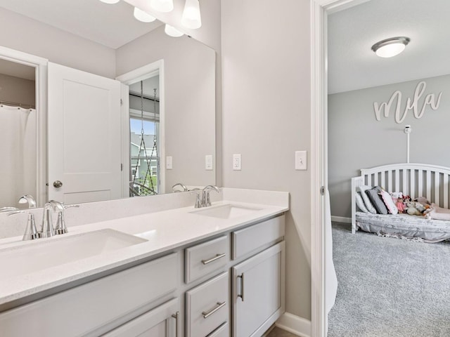 7154 Alphabet St, Chanhassen, MN 55317 - bathroom featuring double vanity and baseboards