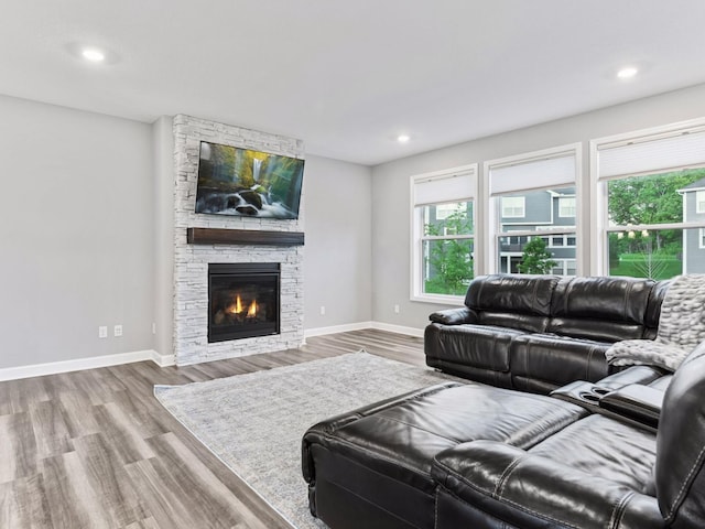7154 Alphabet St, Chanhassen, MN 55317 - living area with wood finished floors, a fireplace, and recessed lighting