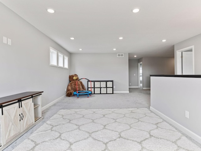 7154 Alphabet St, Chanhassen, MN 55317 - recreation room with recessed lighting and light colored carpet