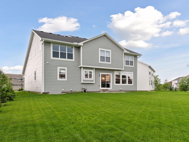 7154 Alphabet St, Chanhassen, MN 55317 - rear view of house featuring a yard and entry steps
