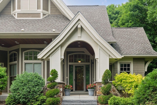 1904 Linner Rd, Minnetonka, MN 55391 - view of exterior entry featuring a shingled roof and a porch