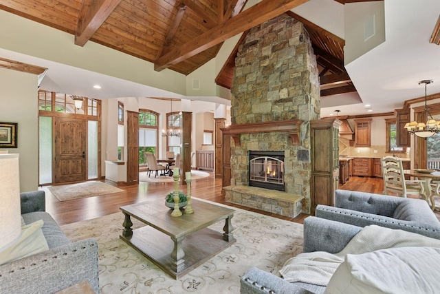 1904 Linner Rd, Minnetonka, MN 55391 - living room with light wood-style floors, a chandelier, plenty of natural light, a fireplace, and wood ceiling