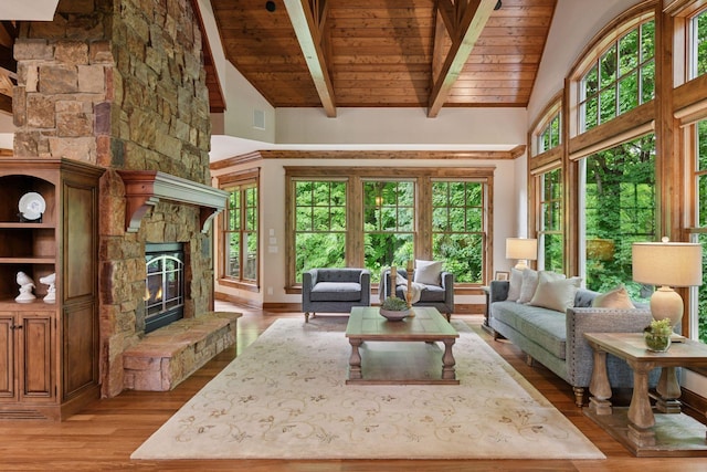 1904 Linner Rd, Minnetonka, MN 55391 - living area featuring high vaulted ceiling, a wood ceiling with exposed beams, light wood-style floors, and a stone fireplace