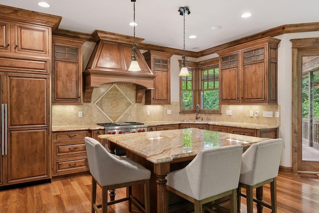 1904 Linner Rd, Minnetonka, MN 55391 - kitchen featuring a breakfast bar area, light wood-type flooring, plenty of natural light, and recessed lighting