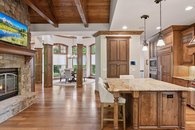 1904 Linner Rd, Minnetonka, MN 55391 - kitchen featuring built in appliances, a chandelier, light stone countertops, light wood-style flooring, and recessed lighting