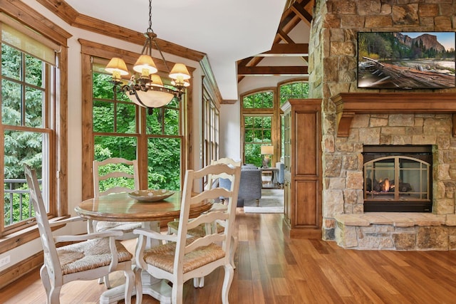 1904 Linner Rd, Minnetonka, MN 55391 - dining area featuring healthy amount of natural light, wood finished floors, a chandelier, and a fireplace