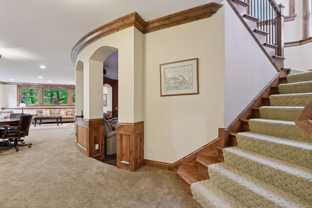 1904 Linner Rd, Minnetonka, MN 55391 - stairs with carpet flooring, arched walkways, recessed lighting, a wainscoted wall, and crown molding