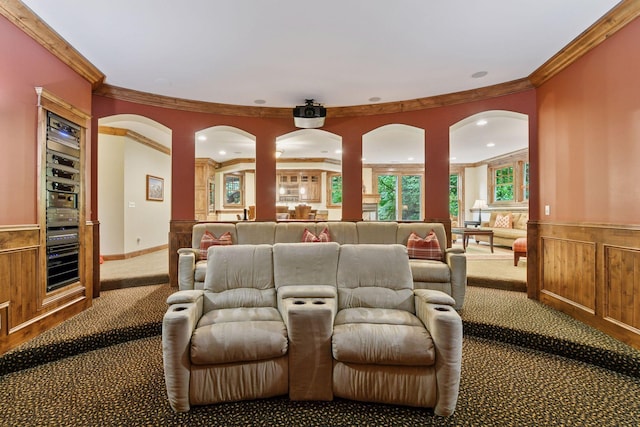1904 Linner Rd, Minnetonka, MN 55391 - carpeted home theater room featuring crown molding, a wainscoted wall, and arched walkways