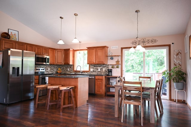 11764 35th Ave SE, Becker, MN 55308 - kitchen featuring appliances with stainless steel finishes, dark countertops, backsplash, vaulted ceiling, and open shelves
