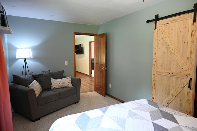 11764 35th Ave SE, Becker, MN 55308 - bedroom with a barn door and carpet flooring