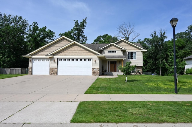 11764 35th Ave SE, Becker, MN 55308 - view of front of property featuring an attached garage, stone siding, and driveway