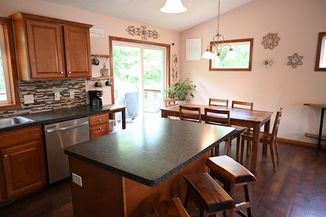 11764 35th Ave SE, Becker, MN 55308 - kitchen featuring dishwasher, vaulted ceiling, brown cabinets, backsplash, and dark countertops