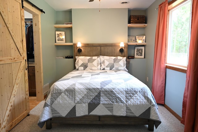 11764 35th Ave SE, Becker, MN 55308 - bedroom featuring a barn door and carpet