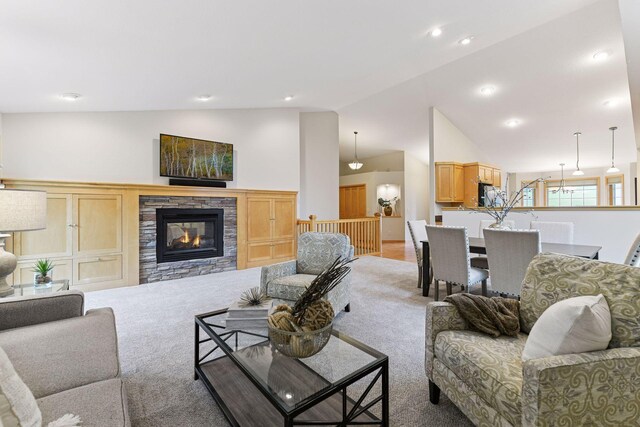 1614 Maple Manors Ct, Mound, MN 55364 - living area with vaulted ceiling, a stone fireplace, recessed lighting, and carpet floors